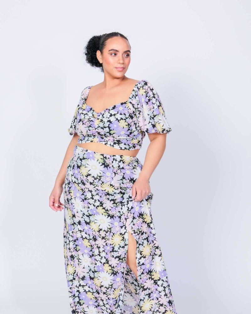Front of a model wearing a size L Sonny & Cher Crop Top and Skirt Set in Daisy Print by LuvMeMore. | dia_product_style_image_id:266597